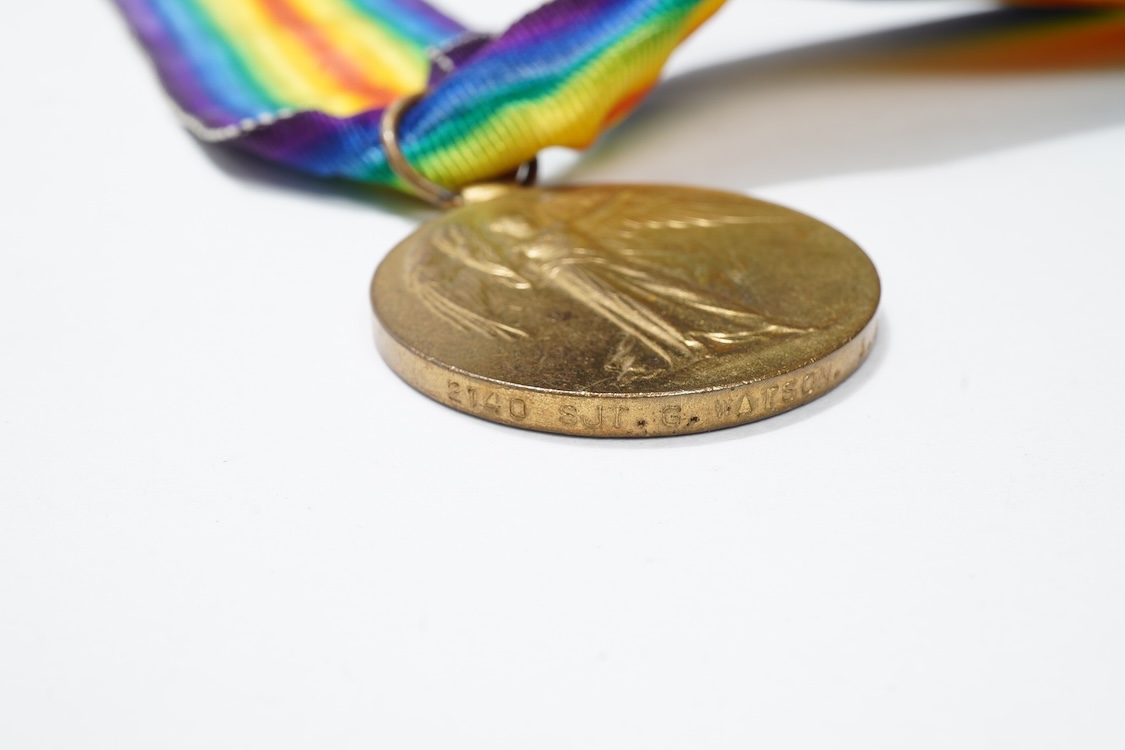 A First World War medal trio awarded to 2140 SJT. G. Watson. Argyll and Sutherland Highlanders, together with the related cap badge and two photographs of Watson in Highlanders uniform and printed as postcards